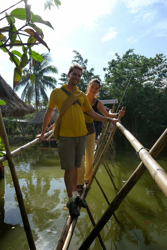 Subtly color-coordinated (that's how we roll) we walk the fine bamboo line that is a bridge at the crocodile farm. But don't get excited, there are no crocs below
