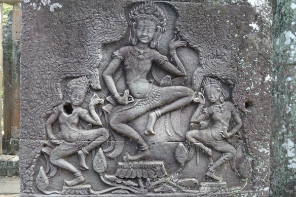 A group of three Apsaras caught in a traditional dance pose. One thing to remember, if you've never seen them in real-life, is that traditional Khmer dance is more of a slow succession of contortionistic poses that ballet per se 