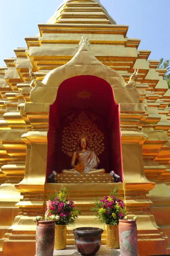 One of the many golden Buddha statues in a temple in Chang Mai